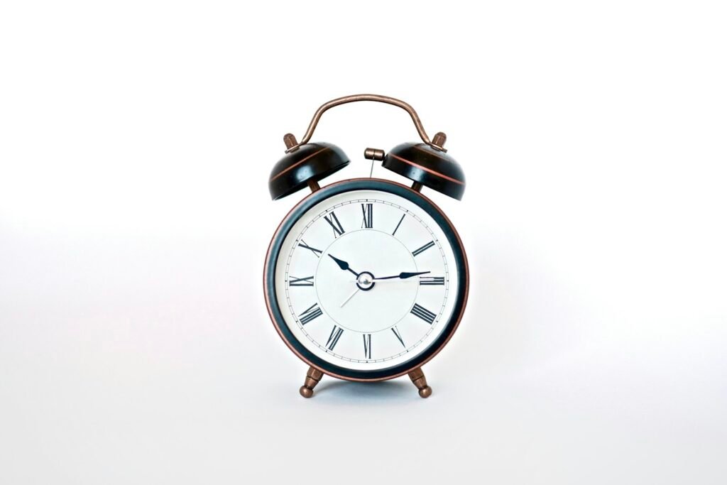 Black and white analog alarm clock